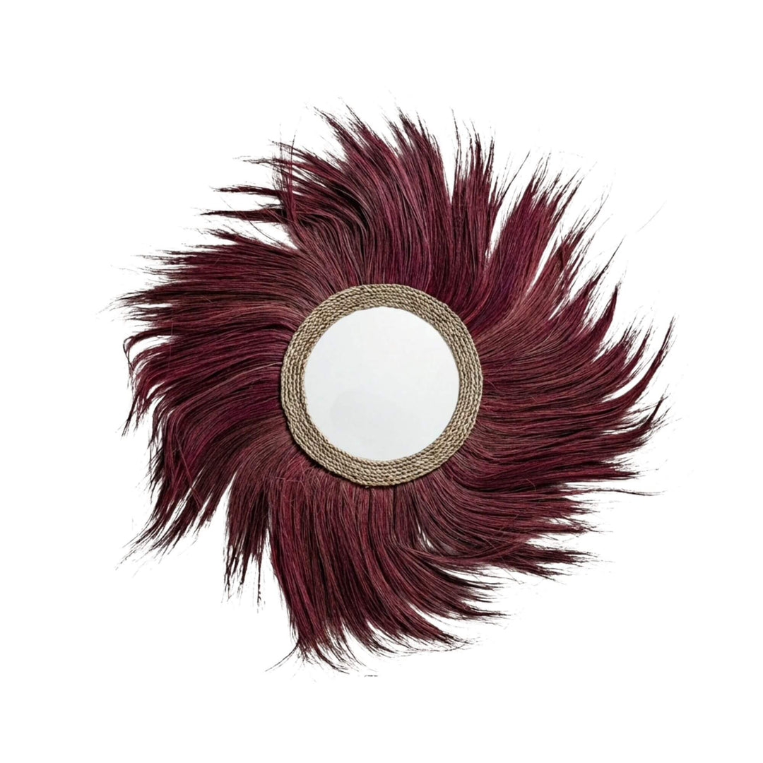Front view of the Sula Lion mirror showcasing its dramatic natural fiber sunburst design and round glass center.