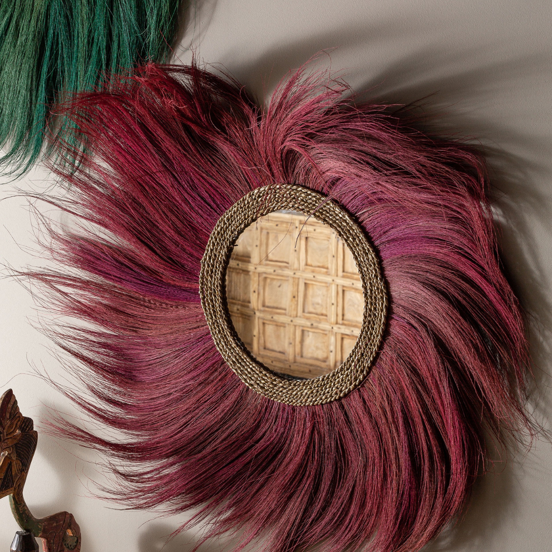Close-up detail highlighting the textured natural fibers and handcrafted finish around the mirror frame.