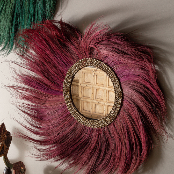 Close-up detail highlighting the textured natural fibers and handcrafted finish around the mirror frame.