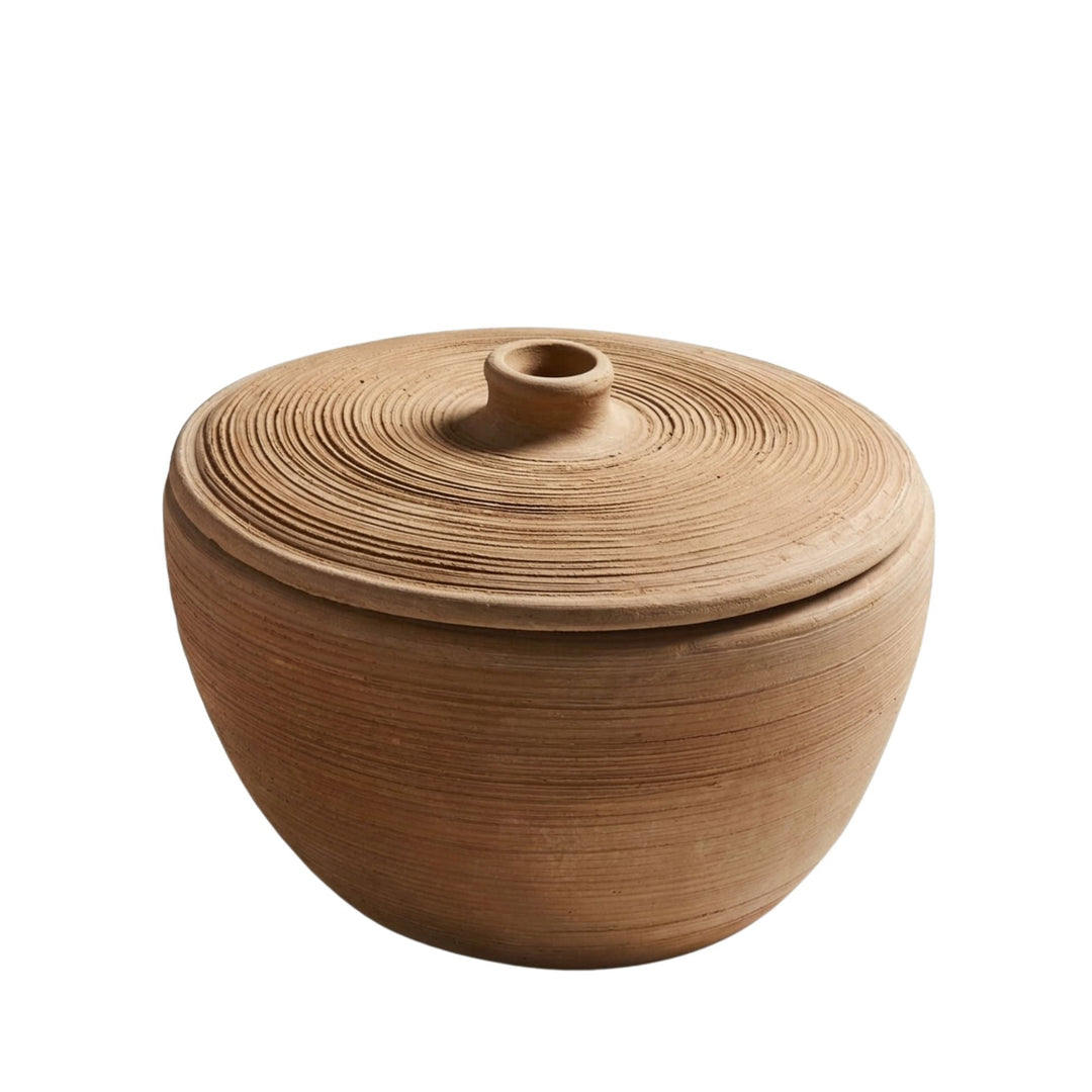 Front view of the Sula terracotta bowl with lid and rounded handcrafted form.