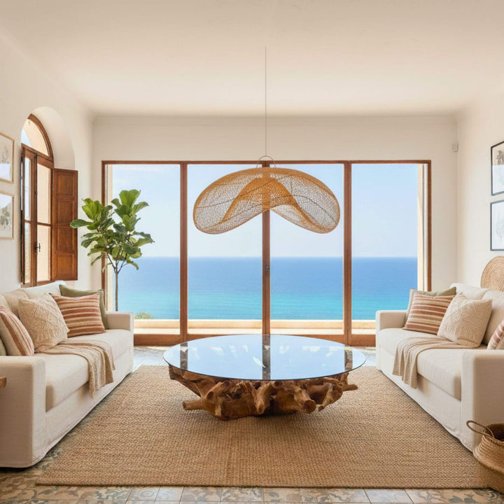 Coffee table styled in a coastal living room with ocean view.
