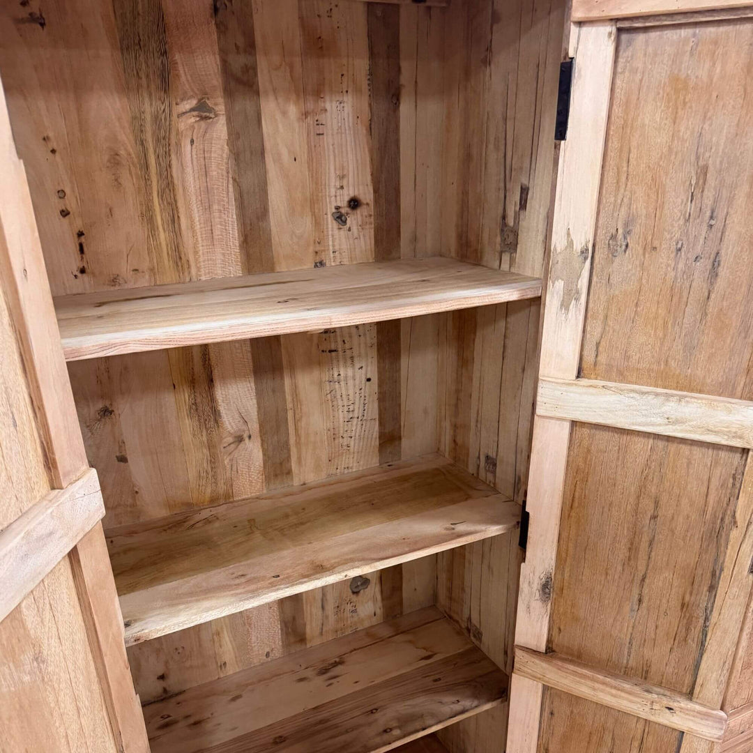 Interior shelves of the Suri Wardrobe crafted from reclaimed wood.