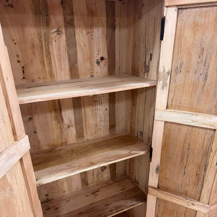 Interior shelves of the Suri Wardrobe crafted from reclaimed wood.