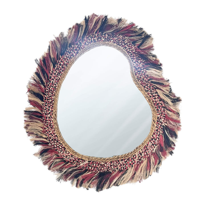 Sawana Mirror made of abaca, sisal, and cotton with an organic frame and multicolor accents, available in two sizes.