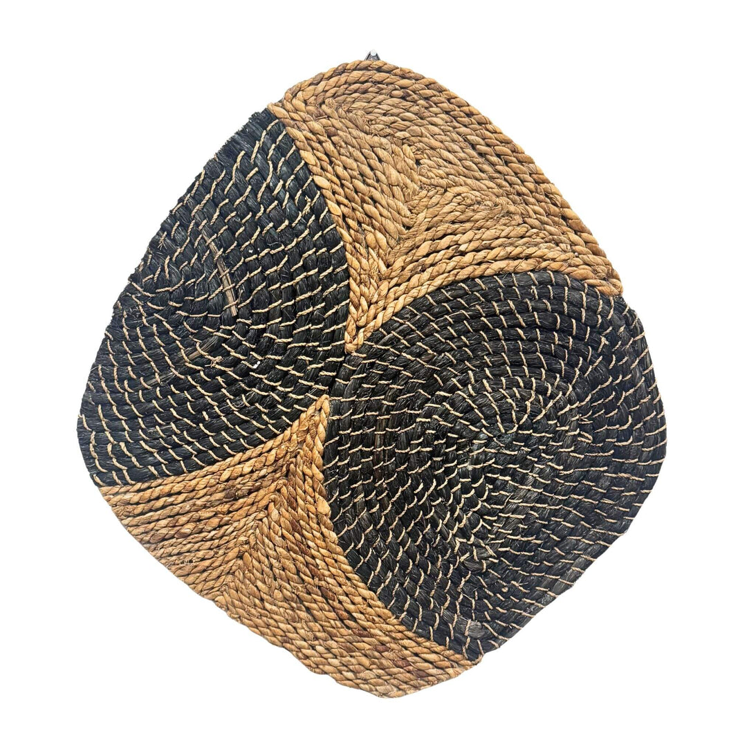 Handwoven Sekar Wall Deco made from abaca and rattan in natural and black swirl design.