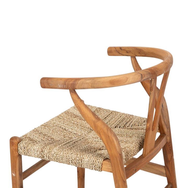 Side view of Tagi dining chair highlighting ergonomic wooden frame and woven texture
