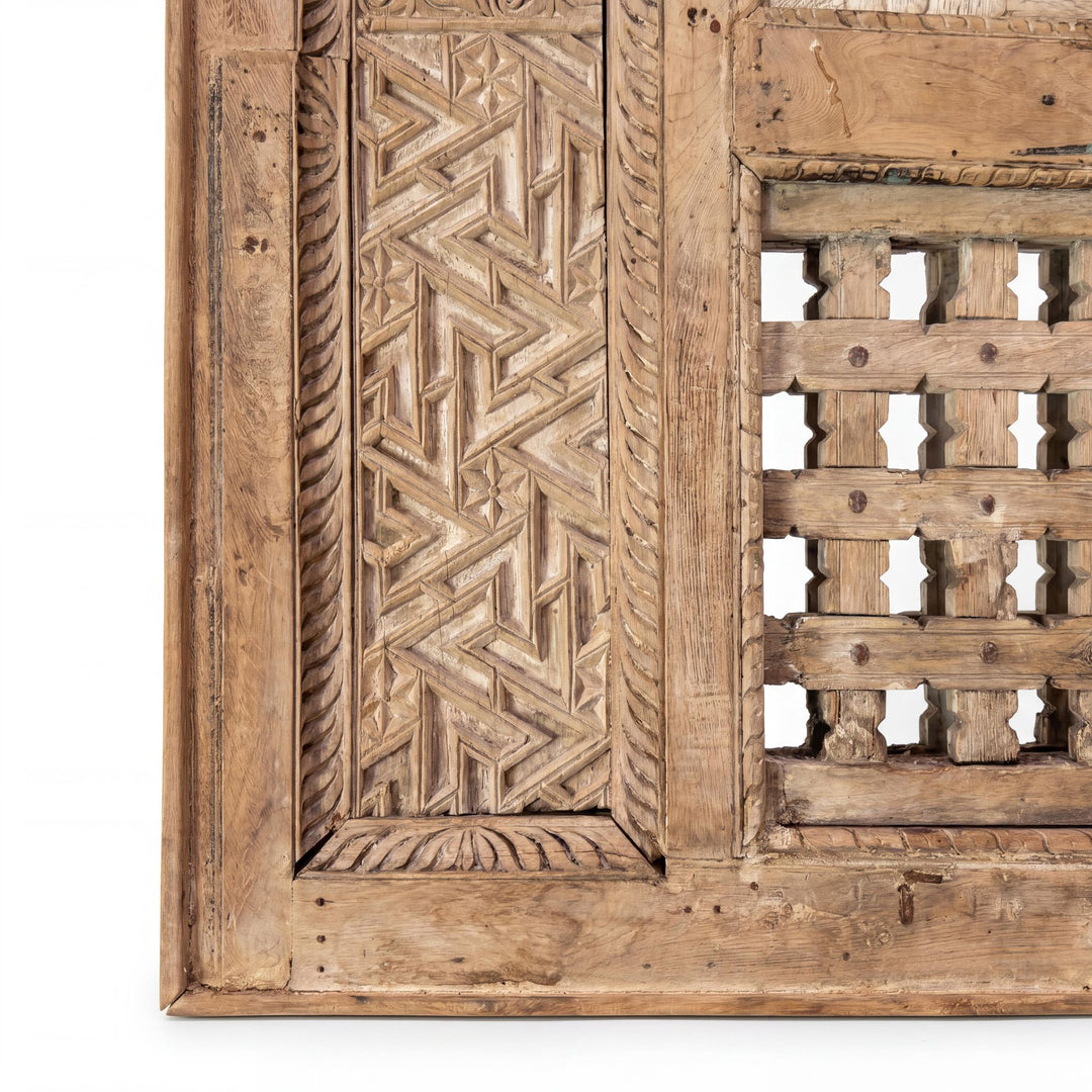 Close-up detail of the carved side panel showing the lattice pattern and handcrafted wood texture.