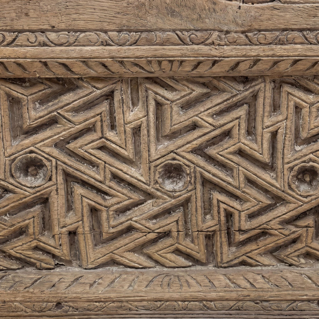 Close-up detail of the upper carved border showing the geometric and floral sheesham wood pattern.