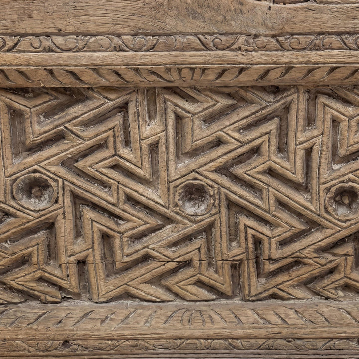 Close-up detail of the upper carved border showing the geometric and floral sheesham wood pattern.