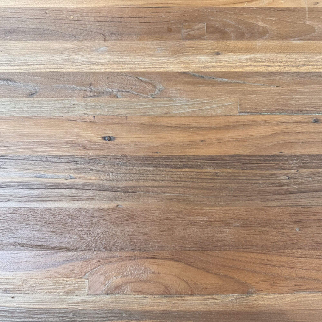 Close-up of the recycled teak tabletop showing natural grain and texture.