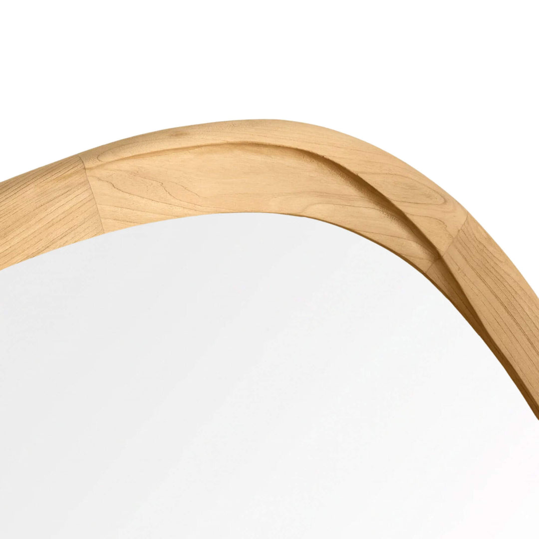 Close-up of the Tao mirror showing the curved profile and natural grain of its sungkai wood frame