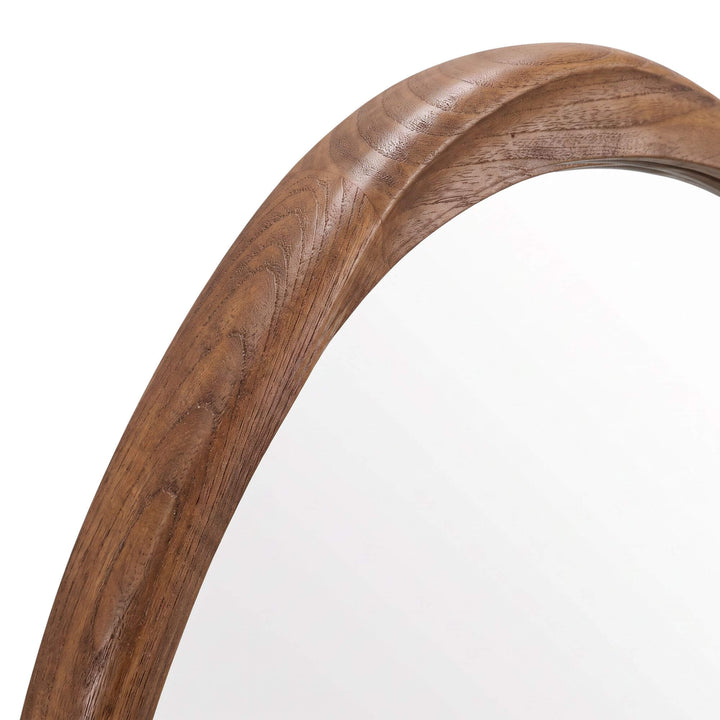 Close-up of the Tao mirror showing the natural grain and rounded profile of the sungkai wood frame