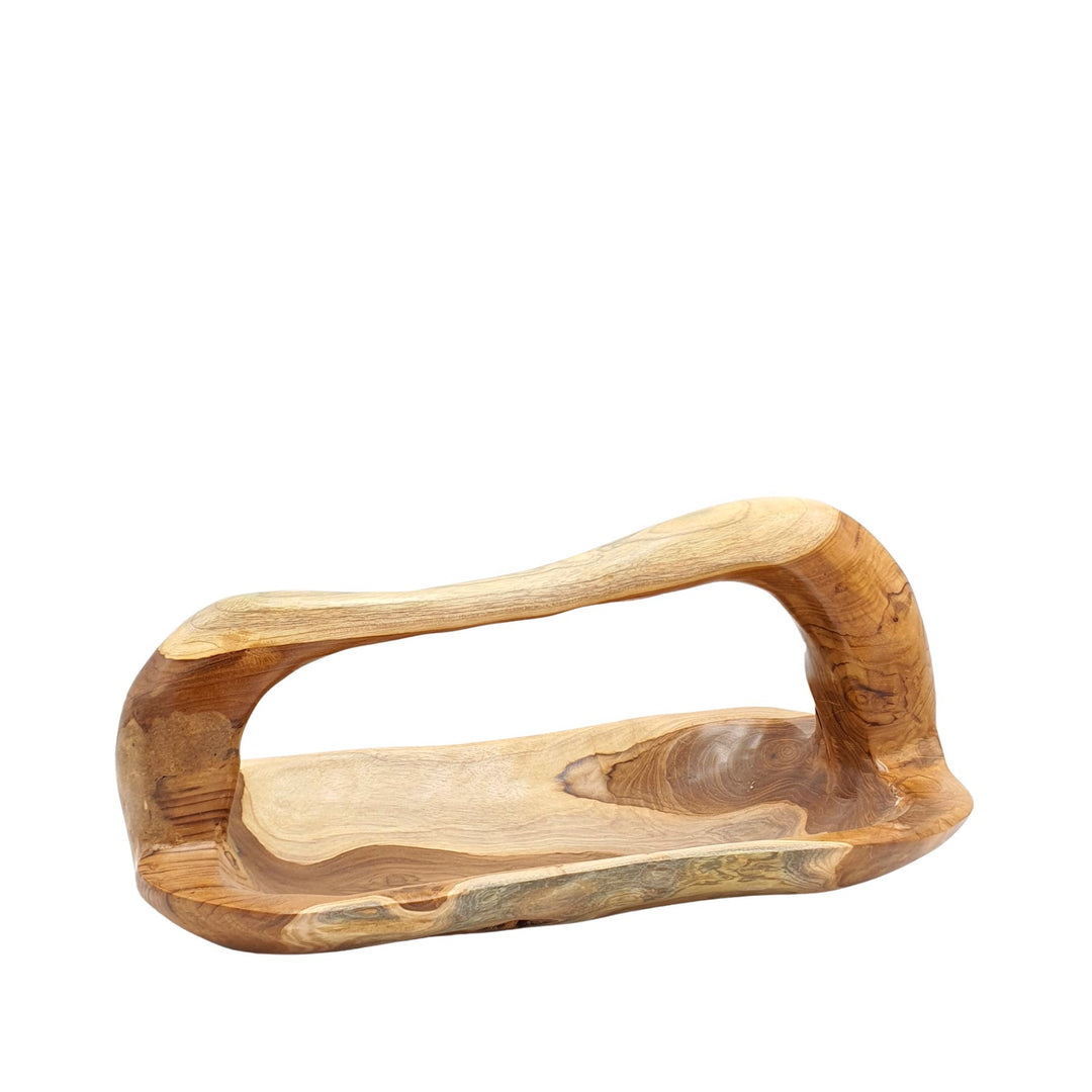 Front view of the Tara teak wood plate with elongated organic shape and integrated handle.