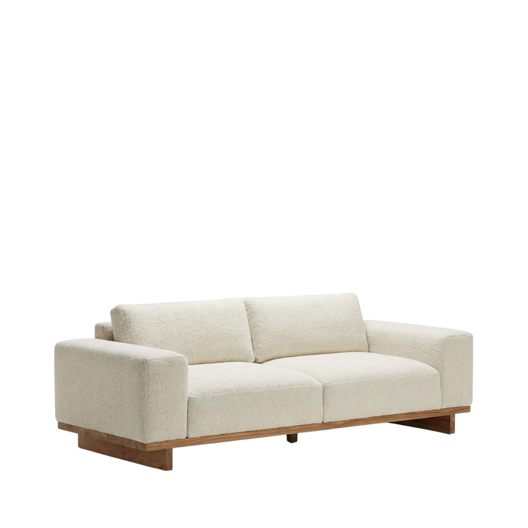 Two-seat outdoor module with upholstered cushions and wooden frame.