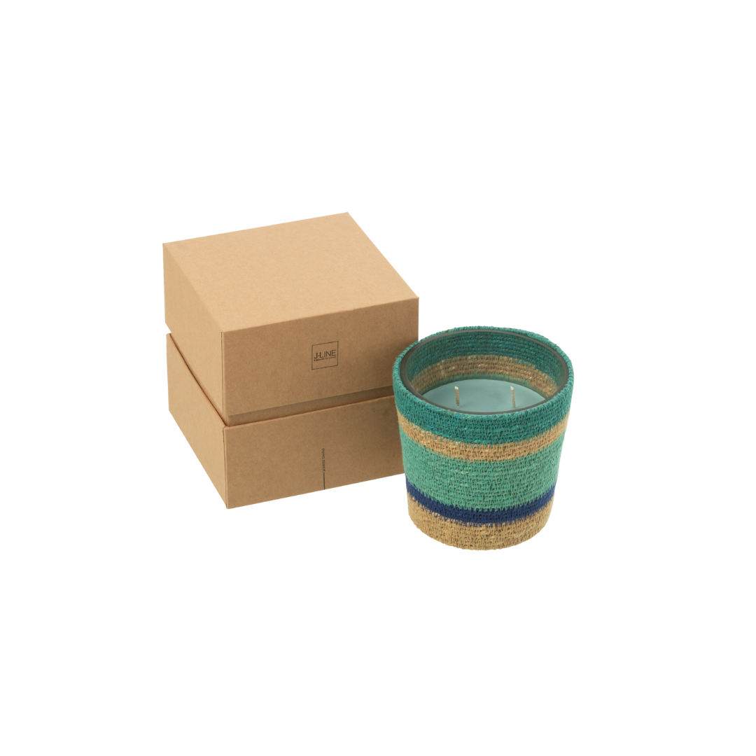 Tazirit candle photographed with packaging boxes emphasizing artisanal presentation.