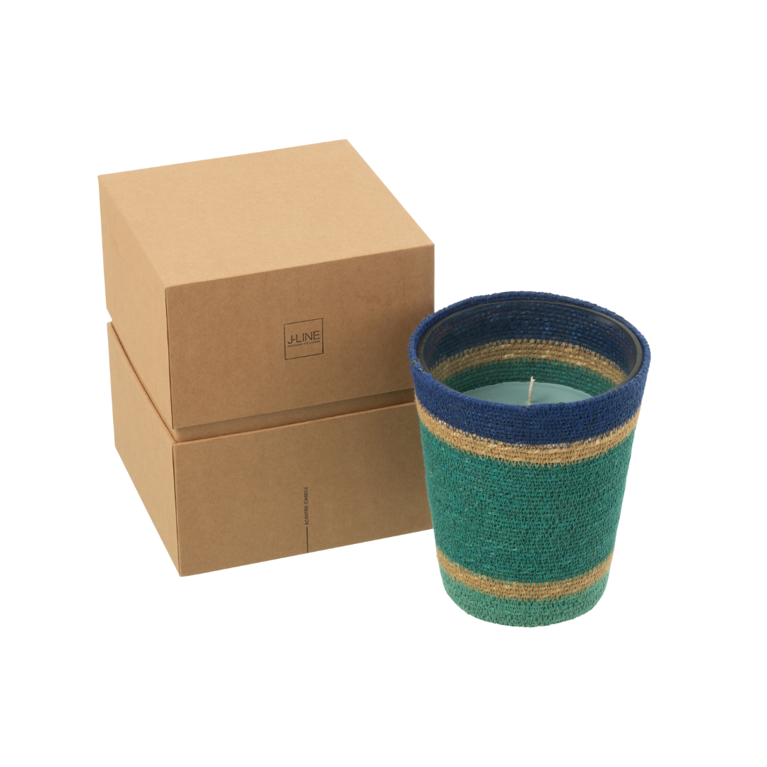 Tazirit candle photographed with packaging boxes emphasizing artisanal presentation.