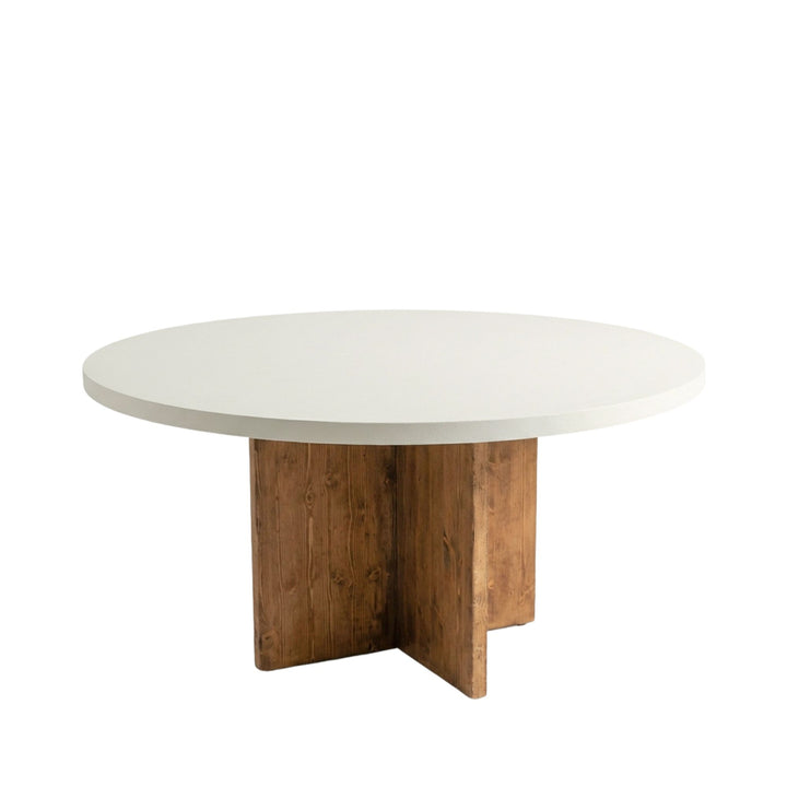 Side view of the round tabletop highlighting the soft edges and refined microcement surface.