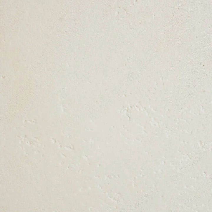 Close-up of the microcement finish displaying subtle texture and handcrafted surface variations.