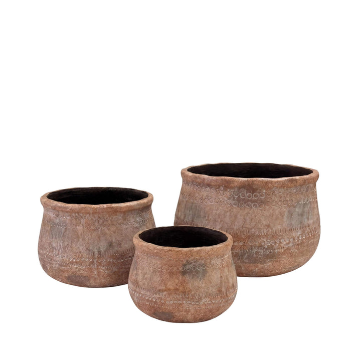 Front view of the Terrane planters showing the three available sizes and aged terracotta-style finish.