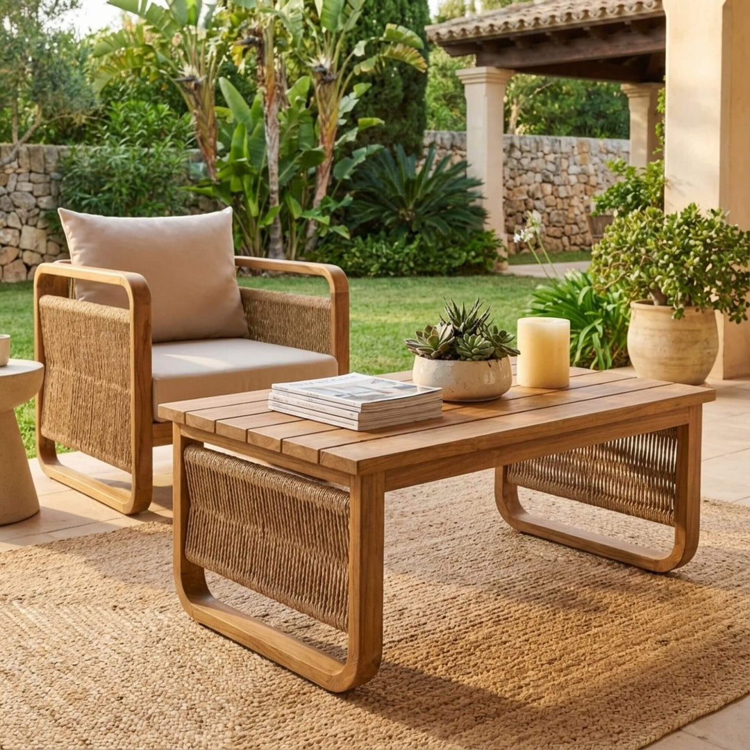 Styled outdoor view of Thai Fiber Coffee Table placed on a terrace with teak seating.