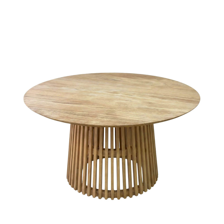 Front angled view of the table highlighting its circular top and architectural wooden base.