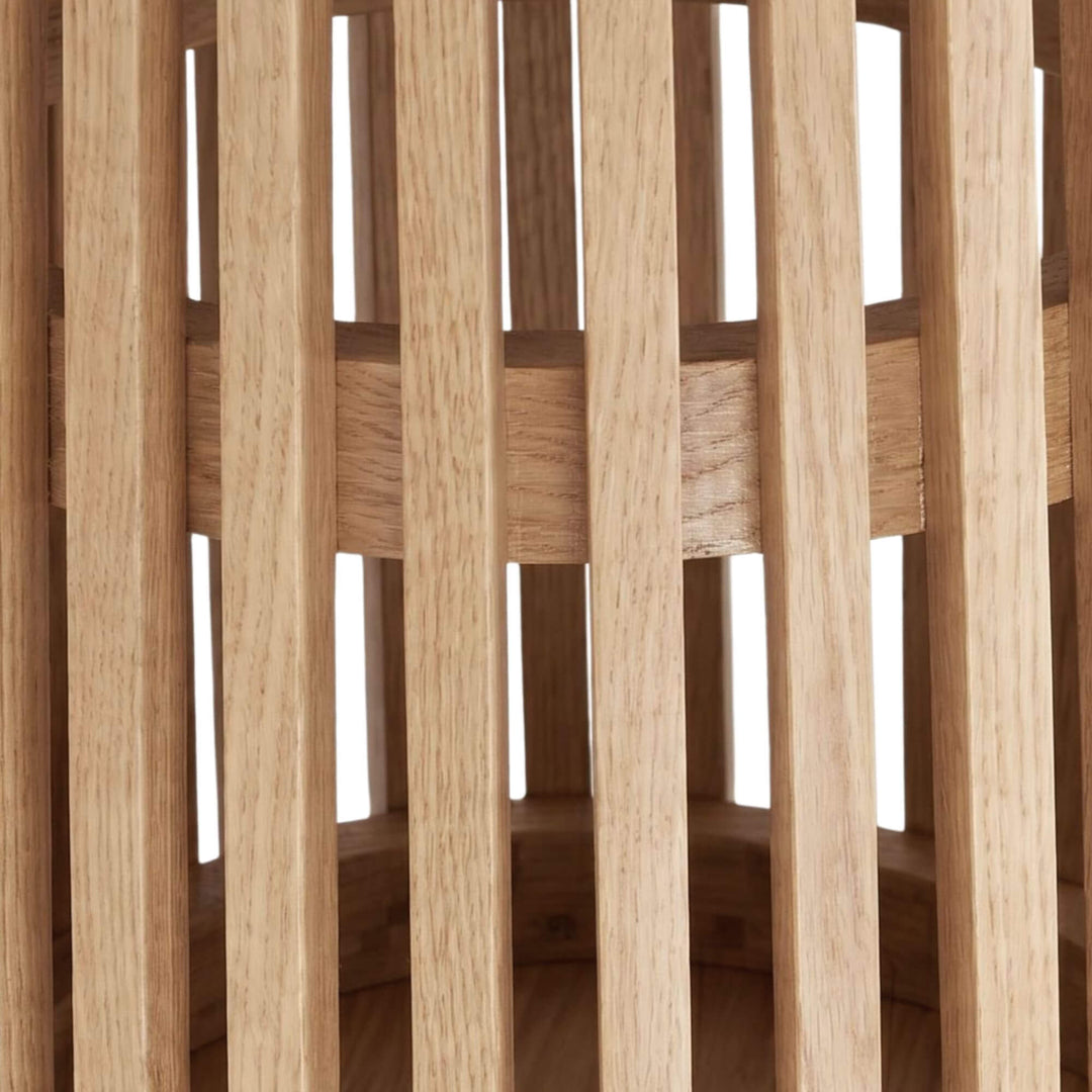 Close-up detail of the slatted base showing the sculptural sungkai wood construction.