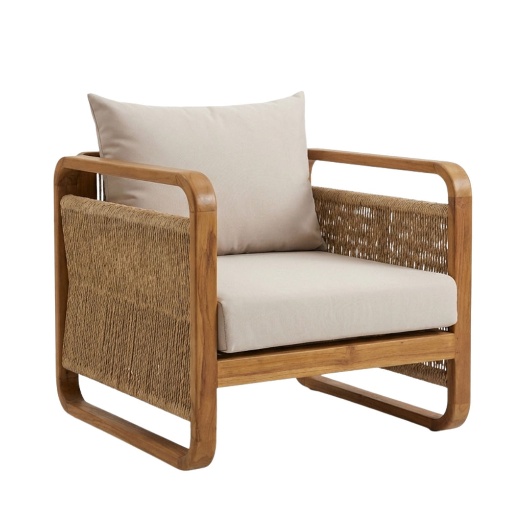 Side angle highlighting the curved teak wood structure and handwoven rattan panels of the armchair.
