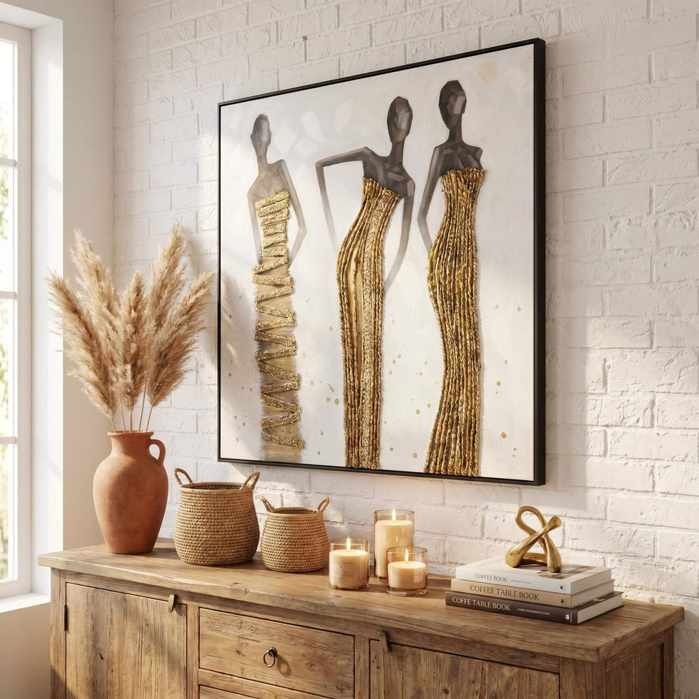 Styled interior setting featuring The Muses artwork displayed above a wooden sideboard in a warm natural space.