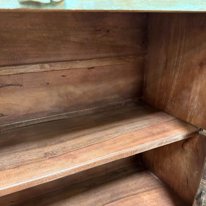 Interior shelving of the Thoha Buffet showing spacious wooden storage.
