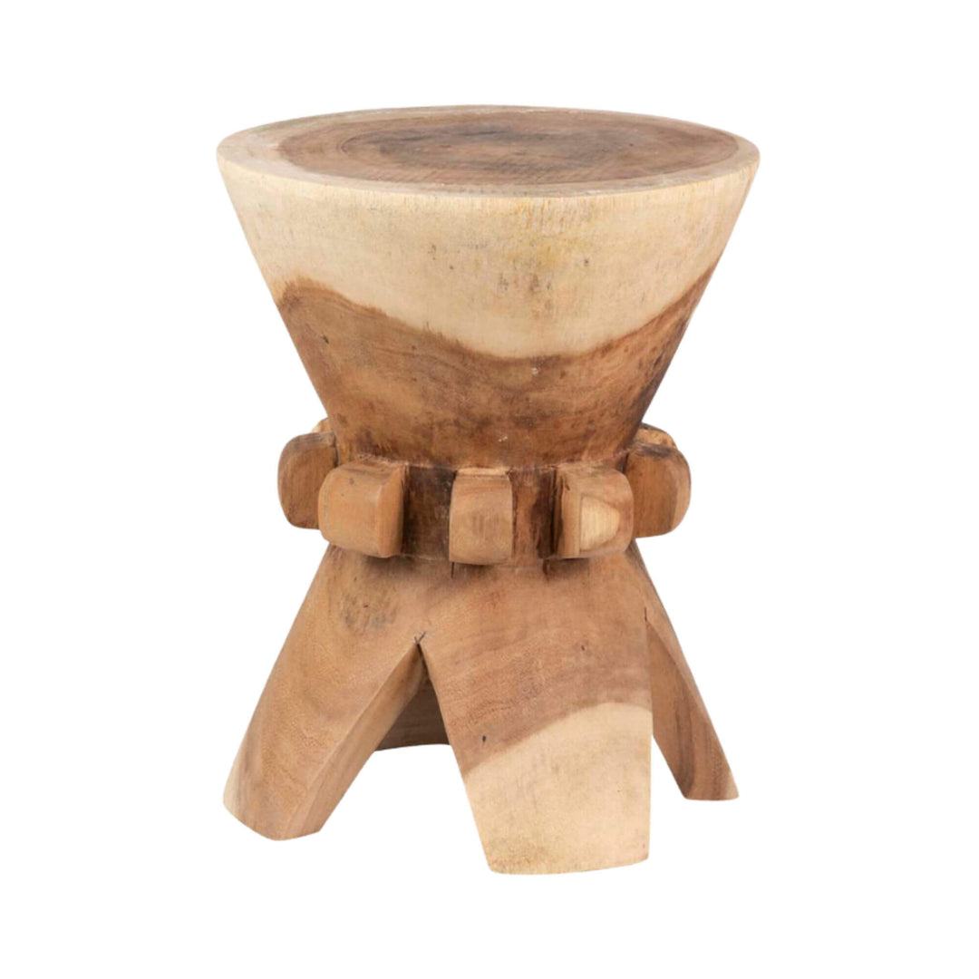 Thorne suar wood stool highlighting its sculptural tripod base and solid top.