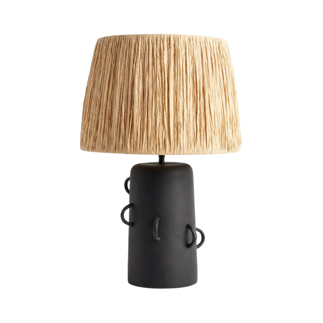 Tikal Table lamp with a black base and woven beige shade on a white background