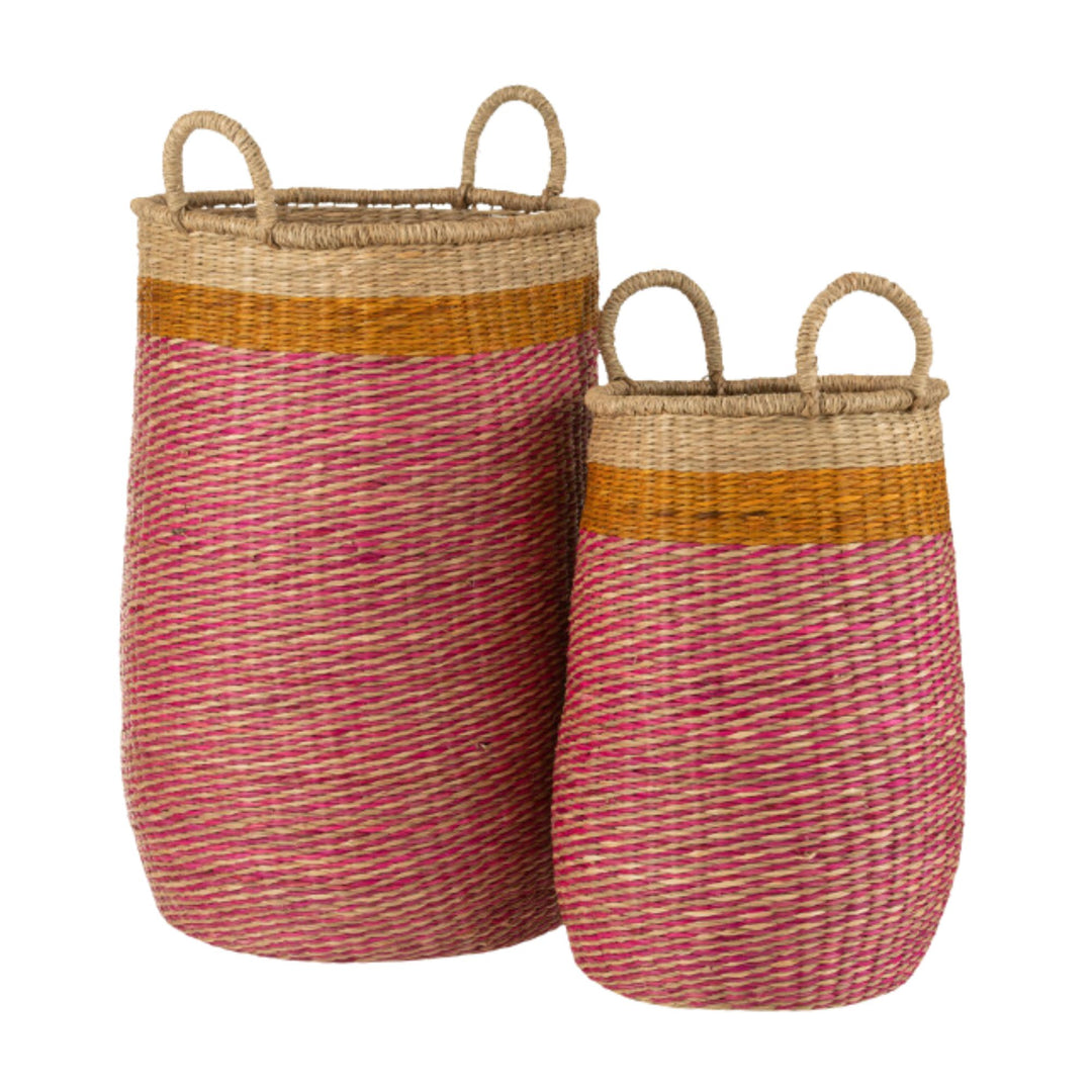 Tikolos Baskets in two sizes made from natural raffia with pink and mustard accents.
