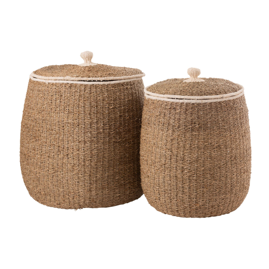 Tiko Baskets in small and large sizes made from natural seagrass with cotton accents.