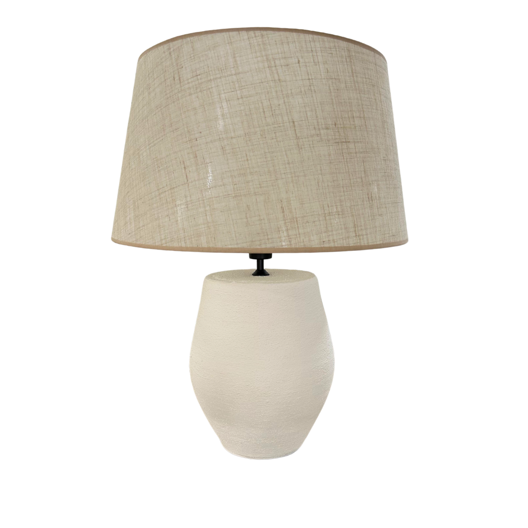 Tina table lamp with white ceramic base and natural fabric shade.