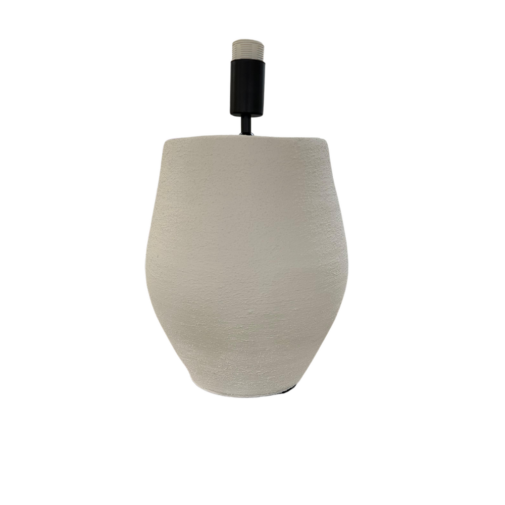 Close-up of Tina lamp base without shade showing white ceramic body and bulb holder.