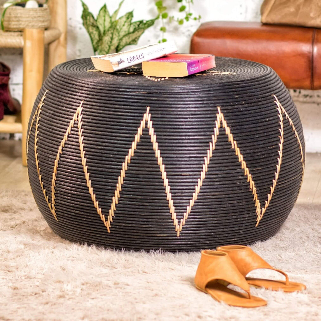 “Round black rattan Togo Coffee Table with intricate geometric patterns.”