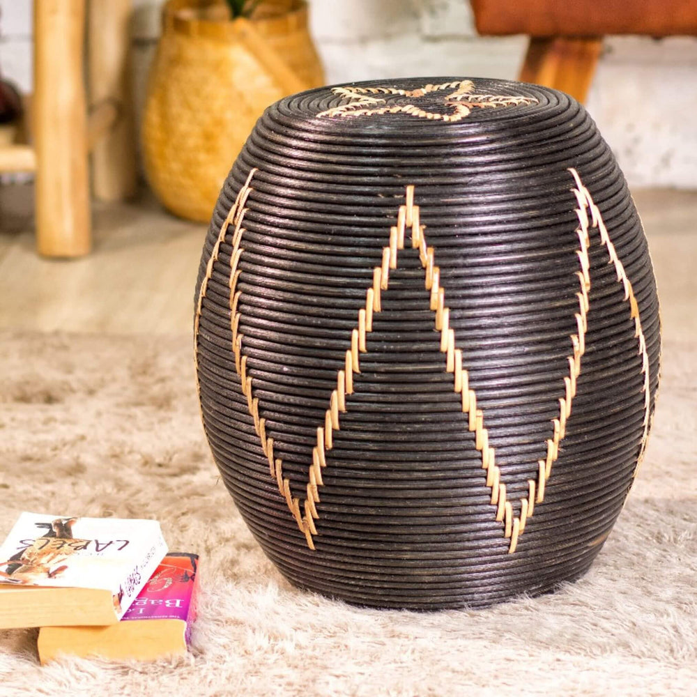 “Compact black rattan Togo Side Table adding texture and artisanal charm to a living space.”