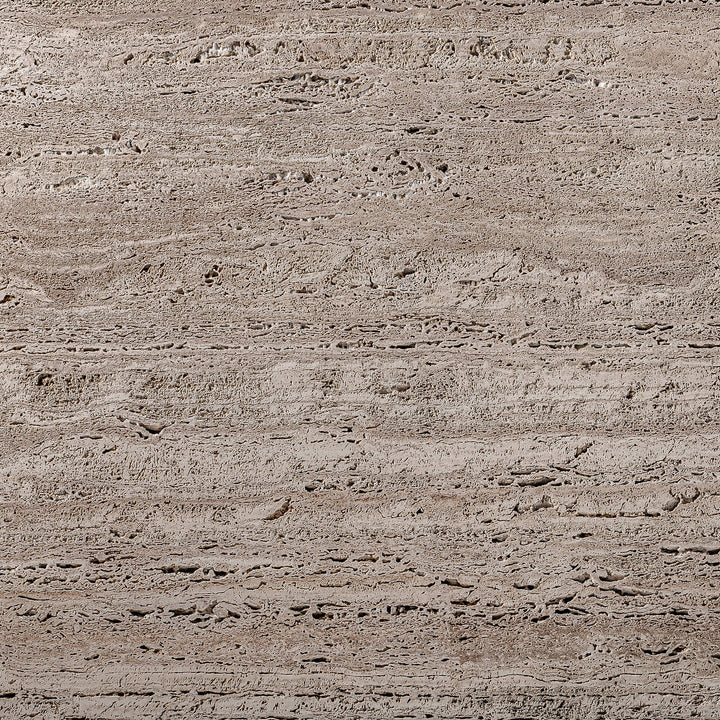 Detail shot of the travertine tabletop showing natural pores and veining.