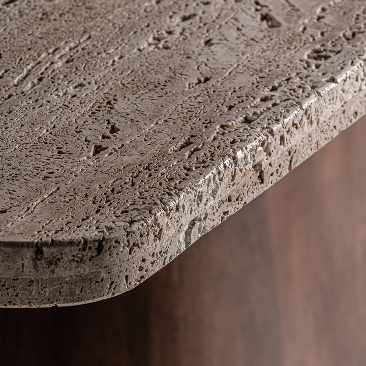 Close-up of the rounded travertine edge on the Toscana Dining Table.