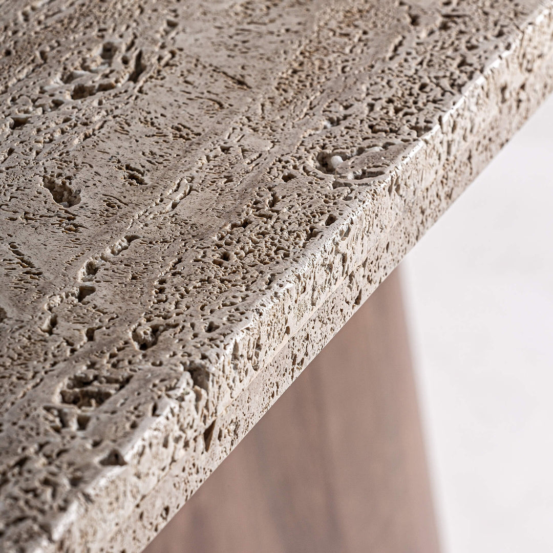 Close-up of the natural acacia wood grain on the pedestal base.