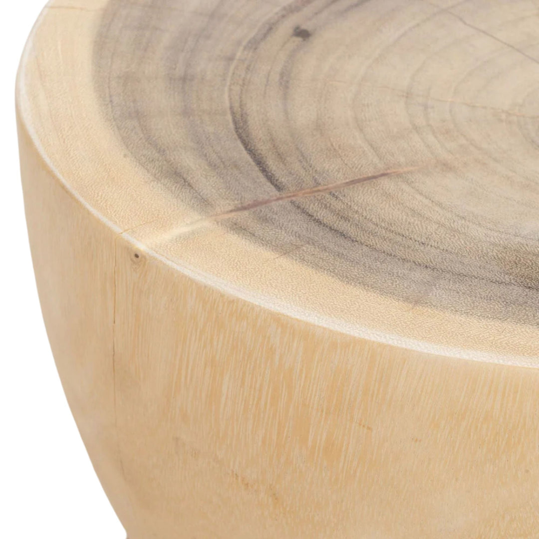 Detail of the tabletop surface showing natural color variations and organic patterns of the suar wood.