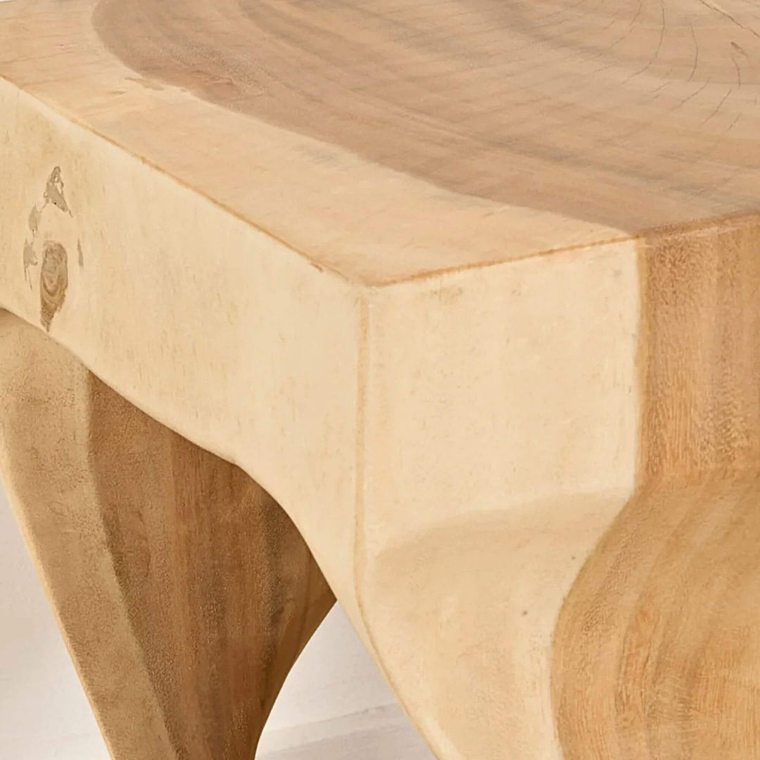 Close-up of the Trembesi Twist side table showing its sculptural twisted wood structure