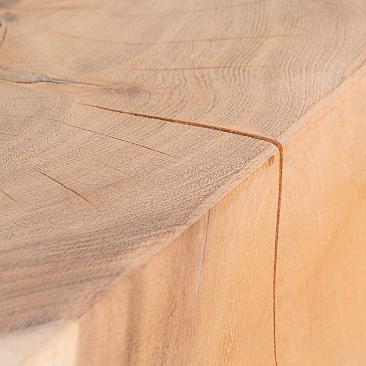 Detail of the Trembesi Twist side table highlighting the natural grain and smooth finish of the suar wood