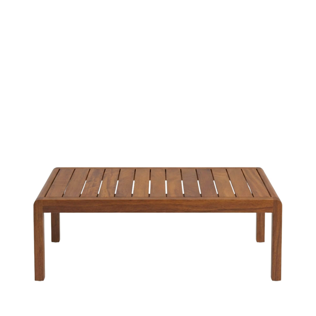 Front view of the Tropika outdoor coffee table showcasing its slatted iroko wood tabletop and clean rectangular shape.