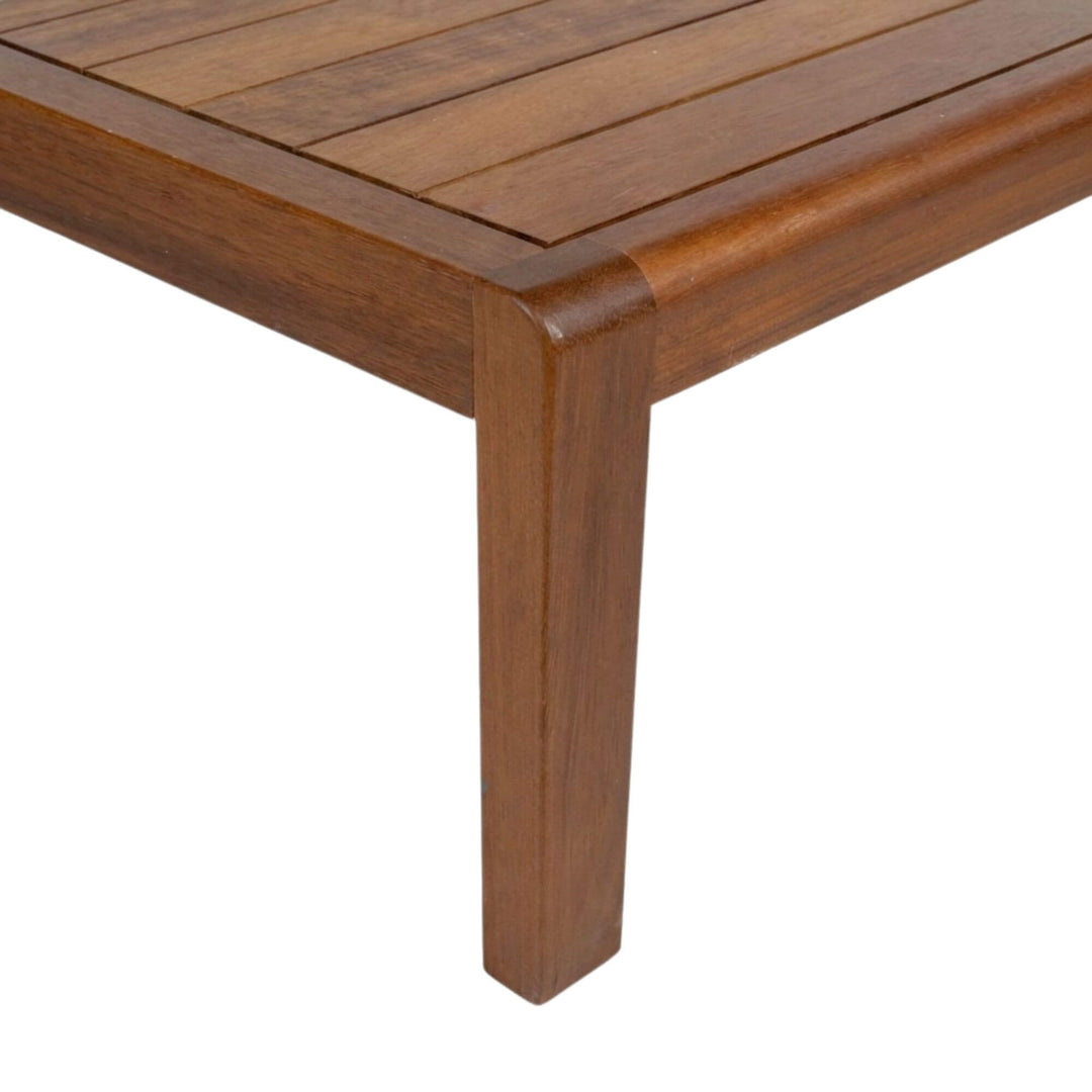 Side view emphasizing the solid wood legs and sturdy outdoor construction.