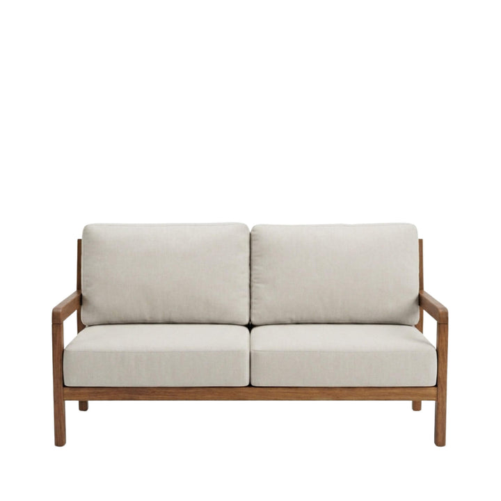 Front view of the Tropika outdoor sofa showcasing its iroko wood frame and neutral cushions.