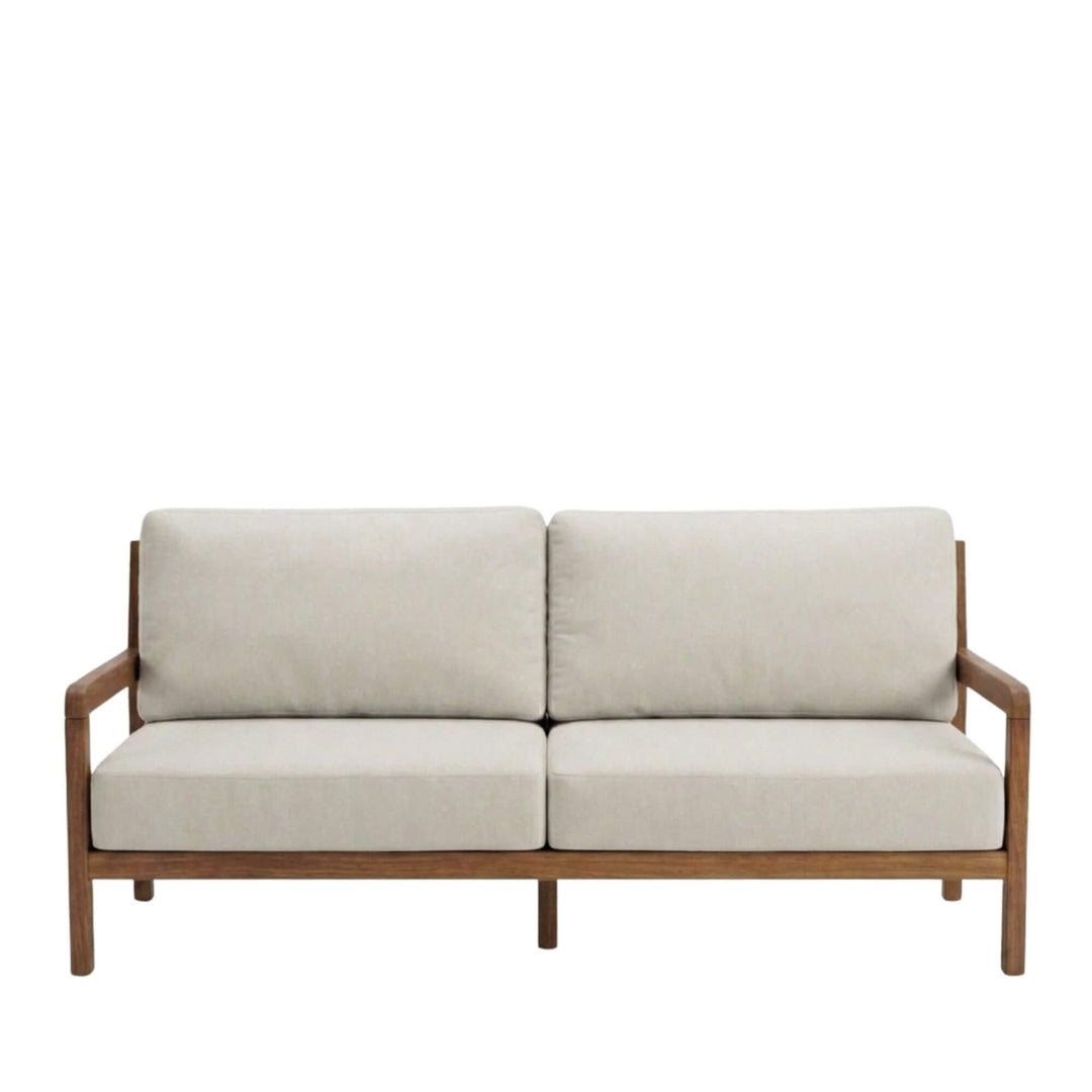 Front view of the Tropika outdoor sofa showcasing its iroko wood frame and neutral cushions.