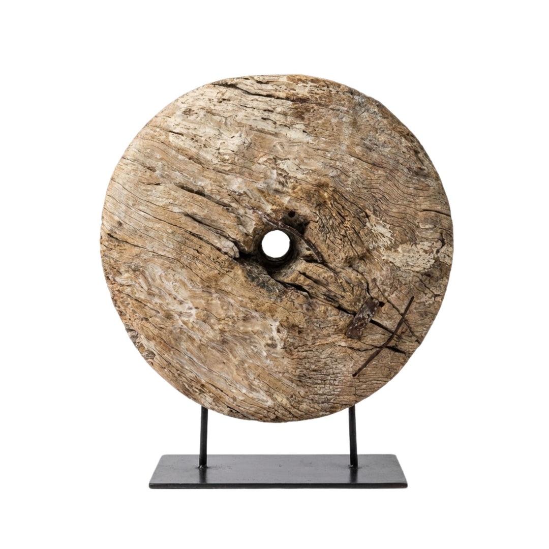 Front view of Tumbril Wheel Stand showcasing the reclaimed wooden wheel mounted on a black metal base.
