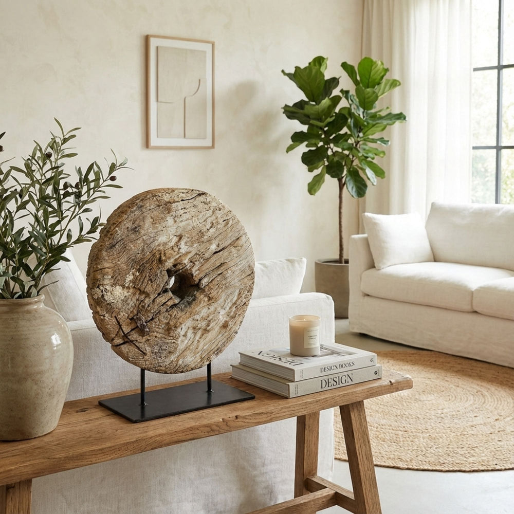 Styled interior view of Tumbril Wheel Stand placed on a console, highlighting its sculptural presence.
