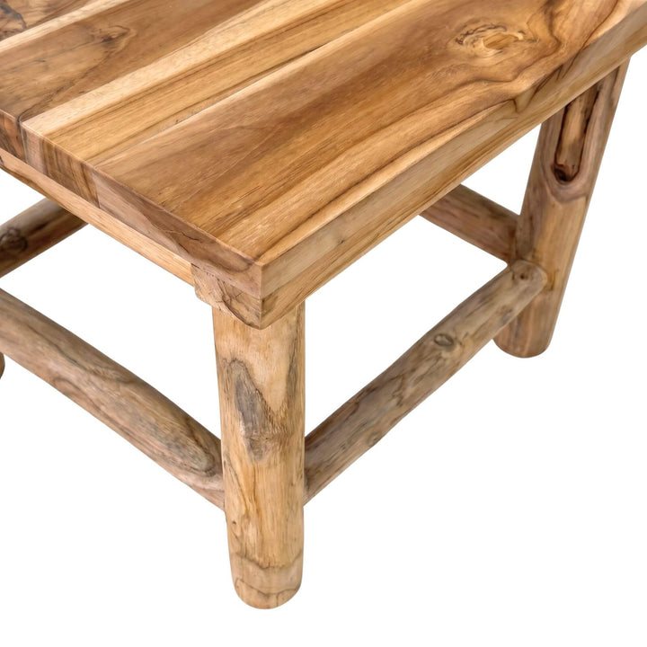 Close-up detail of the seat and frame showing the natural teak wood grain and rustic joinery.